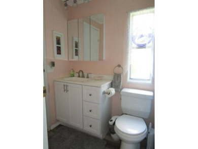 This charming 24 x 40, 2 bedrooms, 2 bath mobile home offers the on Grasslands Golf and Country Club in Florida - for sale on GolfHomes.com, golf home, golf lot