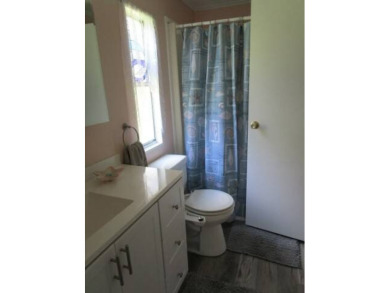 This charming 24 x 40, 2 bedrooms, 2 bath mobile home offers the on Grasslands Golf and Country Club in Florida - for sale on GolfHomes.com, golf home, golf lot