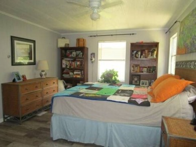 This charming 24 x 40, 2 bedrooms, 2 bath mobile home offers the on Grasslands Golf and Country Club in Florida - for sale on GolfHomes.com, golf home, golf lot