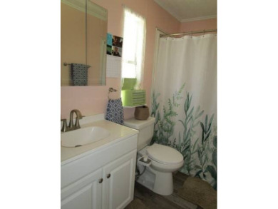 This charming 24 x 40, 2 bedrooms, 2 bath mobile home offers the on Grasslands Golf and Country Club in Florida - for sale on GolfHomes.com, golf home, golf lot