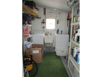 This charming 24 x 40, 2 bedrooms, 2 bath mobile home offers the on Grasslands Golf and Country Club in Florida - for sale on GolfHomes.com, golf home, golf lot