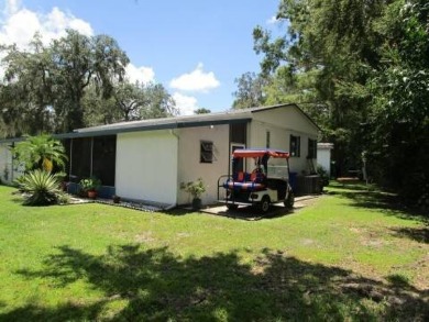 This charming 24 x 40, 2 bedrooms, 2 bath mobile home offers the on Grasslands Golf and Country Club in Florida - for sale on GolfHomes.com, golf home, golf lot