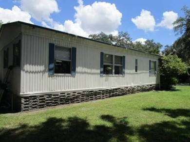 This charming 24 x 40, 2 bedrooms, 2 bath mobile home offers the on Grasslands Golf and Country Club in Florida - for sale on GolfHomes.com, golf home, golf lot