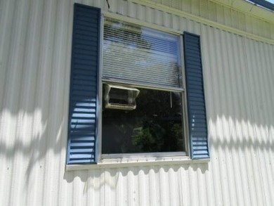This charming 24 x 40, 2 bedrooms, 2 bath mobile home offers the on Grasslands Golf and Country Club in Florida - for sale on GolfHomes.com, golf home, golf lot