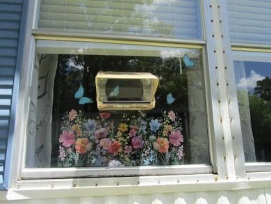 This charming 24 x 40, 2 bedrooms, 2 bath mobile home offers the on Grasslands Golf and Country Club in Florida - for sale on GolfHomes.com, golf home, golf lot