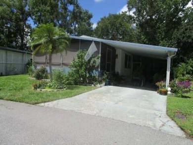This charming 24 x 40, 2 bedrooms, 2 bath mobile home offers the on Grasslands Golf and Country Club in Florida - for sale on GolfHomes.com, golf home, golf lot