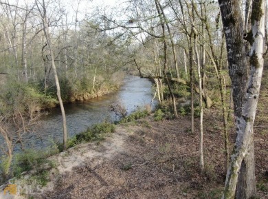 RIVER FRONT. Large wooded building site with frontage on the on The Club River Forest in Georgia - for sale on GolfHomes.com, golf home, golf lot