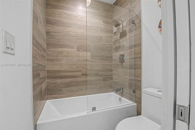 Completely renovated and rarely available first-floor residence on Granada Golf Club in Florida - for sale on GolfHomes.com, golf home, golf lot