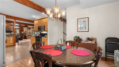 Welcome to this enchanting rustic retreat nestled within the on The Club At Old Kinderhook in Missouri - for sale on GolfHomes.com, golf home, golf lot