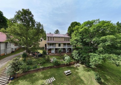 Lake Nottely Retreat boasts spacious 4BR-3BA home. Upon entry on Butternut Creek Golf Course in Georgia - for sale on GolfHomes.com, golf home, golf lot