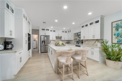 Nestled on spectaular premium lot with full lake and golf course on Willoughby Golf Club in Florida - for sale on GolfHomes.com, golf home, golf lot