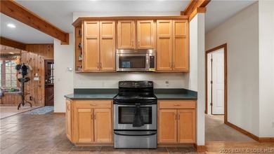 Welcome to this enchanting rustic retreat nestled within the on The Club At Old Kinderhook in Missouri - for sale on GolfHomes.com, golf home, golf lot