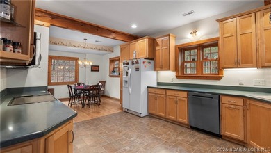 Welcome to this enchanting rustic retreat nestled within the on The Club At Old Kinderhook in Missouri - for sale on GolfHomes.com, golf home, golf lot