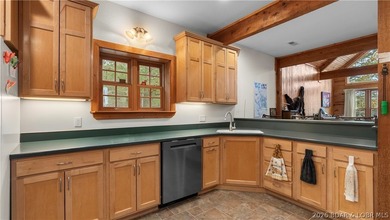 Welcome to this enchanting rustic retreat nestled within the on The Club At Old Kinderhook in Missouri - for sale on GolfHomes.com, golf home, golf lot