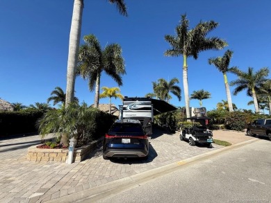 STUNNING NORTH-FACING PULL-IN LOT WITH WATER VIEWS! This lot is on Motorcoach Resort Golf Course in Florida - for sale on GolfHomes.com, golf home, golf lot