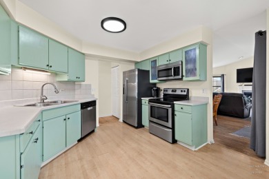 Welcome to this light and bright 2nd-floor end unit in the on The Golf Club of Illinois in Illinois - for sale on GolfHomes.com, golf home, golf lot