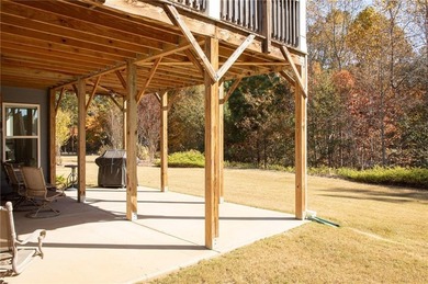 Discover relaxed, resort-style living in this charming on Lanier Island Legacy Golf Couorse in Georgia - for sale on GolfHomes.com, golf home, golf lot