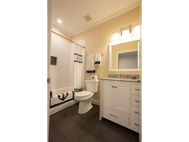 Discover relaxed, resort-style living in this charming on Lanier Island Legacy Golf Couorse in Georgia - for sale on GolfHomes.com, golf home, golf lot