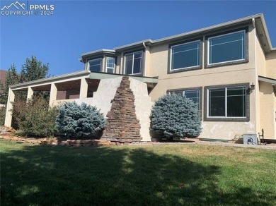 This beautiful home overlooking Pine Creek Golf Course is on Pine Creek Golf Club in Colorado - for sale on GolfHomes.com, golf home, golf lot