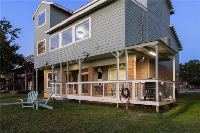 The back porch to this lake house has some of the prettiest on Hideout Golf Club and Resort  in Texas - for sale on GolfHomes.com, golf home, golf lot