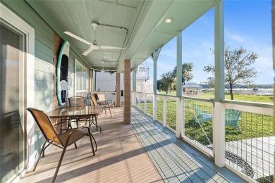 The back porch to this lake house has some of the prettiest on Hideout Golf Club and Resort  in Texas - for sale on GolfHomes.com, golf home, golf lot