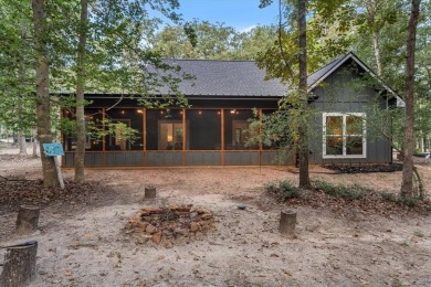 Discover modern living with a rustic touch at Holly Lake Ranch on Holly Lake Ranch Golf Club in Texas - for sale on GolfHomes.com, golf home, golf lot