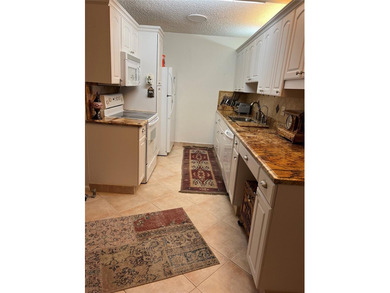 RENOVATED,FRESH PAINT, EXPANSIVE WATER VIEW, WALK TO HOUSES OF on Hillsboro Pines Golf in Florida - for sale on GolfHomes.com, golf home, golf lot