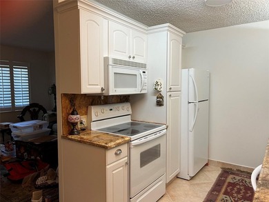 RENOVATED,FRESH PAINT, EXPANSIVE WATER VIEW, WALK TO HOUSES OF on Hillsboro Pines Golf in Florida - for sale on GolfHomes.com, golf home, golf lot