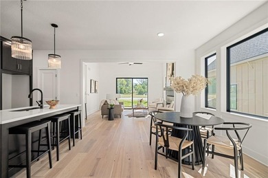 Discover modern, low-maintenance living in this stunning 1 on The Golf Club of Kansas in Kansas - for sale on GolfHomes.com, golf home, golf lot