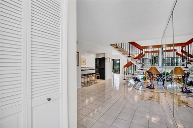 3/2.5 Alhambra Townhome, just under 1900sq ft, waterfront & on Pine Island Ridge Country Club in Florida - for sale on GolfHomes.com, golf home, golf lot