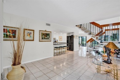 3/2.5 Alhambra Townhome, just under 1900sq ft, waterfront & on Pine Island Ridge Country Club in Florida - for sale on GolfHomes.com, golf home, golf lot