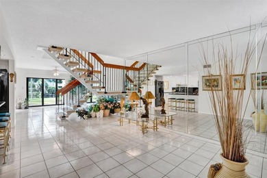 3/2.5 Alhambra Townhome, just under 1900sq ft, waterfront & on Pine Island Ridge Country Club in Florida - for sale on GolfHomes.com, golf home, golf lot