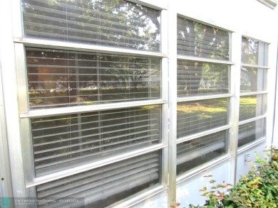 REDUCED! PRICED TO INVEST & FLIP OR TAKE ADVANTAGE OF A BLANK on Wynmoor Golf Course in Florida - for sale on GolfHomes.com, golf home, golf lot