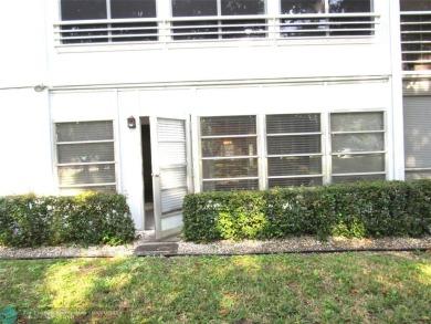 REDUCED! PRICED TO INVEST & FLIP OR TAKE ADVANTAGE OF A BLANK on Wynmoor Golf Course in Florida - for sale on GolfHomes.com, golf home, golf lot