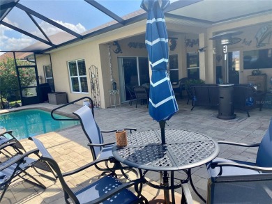 THIS POOL HOME IS A RARE FIND WITH VIEWS AND PRIVACY ON THE GOLF on Lake Ashton Golf Club in Florida - for sale on GolfHomes.com, golf home, golf lot