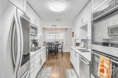 Classic all-brick home perfectly positioned on Hole 1 of the on Cherokee Rose Country Club in Georgia - for sale on GolfHomes.com, golf home, golf lot