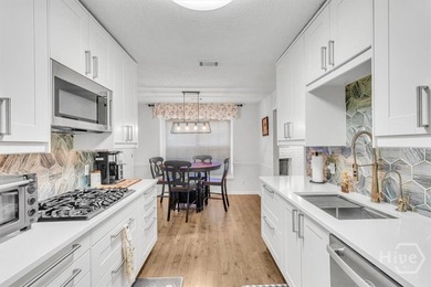 Classic all-brick home perfectly positioned on Hole 1 of the on Cherokee Rose Country Club in Georgia - for sale on GolfHomes.com, golf home, golf lot