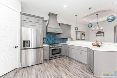 Beautiful lakefront home in the SPI Golf Community! This on South Padre Island Golf Club in Texas - for sale on GolfHomes.com, golf home, golf lot