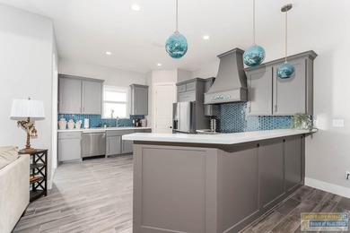 Beautiful lakefront home in the SPI Golf Community! This on South Padre Island Golf Club in Texas - for sale on GolfHomes.com, golf home, golf lot