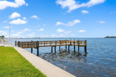 Live the small beach town lifestyle in this beautiful waterfront on The Dunedin Country Club in Florida - for sale on GolfHomes.com, golf home, golf lot