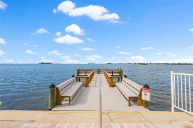 Live the small beach town lifestyle in this beautiful waterfront on The Dunedin Country Club in Florida - for sale on GolfHomes.com, golf home, golf lot