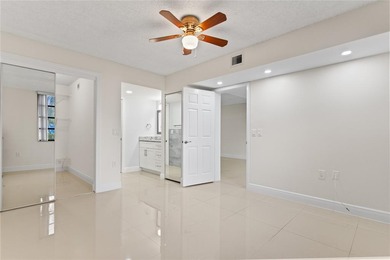 Beautiful 2-bedroom, 2-bathroom condo with a versatile bonus on Pine Island Ridge Country Club in Florida - for sale on GolfHomes.com, golf home, golf lot