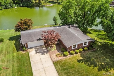 Discover your dream home at this stunning waterfront oasis on Tamarack Country Club in Illinois - for sale on GolfHomes.com, golf home, golf lot