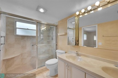 *CORNER UNIT* with a *WATER VIEW***MOTIVATED SELLER*** Parquet on Wynmoor Golf Course in Florida - for sale on GolfHomes.com, golf home, golf lot