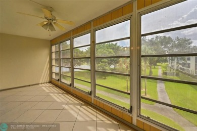 *CORNER UNIT* with a *WATER VIEW***MOTIVATED SELLER*** Parquet on Wynmoor Golf Course in Florida - for sale on GolfHomes.com, golf home, golf lot