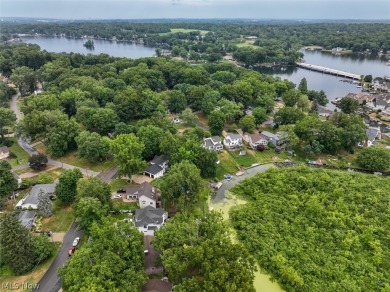 Look no further than this exceptional brick and wood ranch home on Turkeyfoot Lake Golf Links in Ohio - for sale on GolfHomes.com, golf home, golf lot