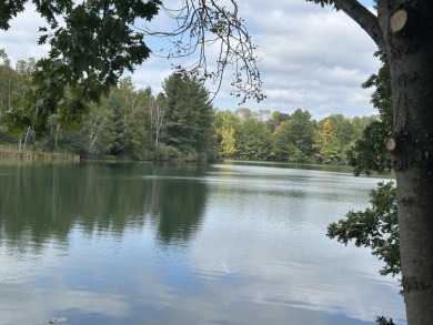 Waterfront Lot on Lake of the Clouds in Canadian Lakes!! on Canadian Lakes Country Club-The Highlands Course in Michigan - for sale on GolfHomes.com, golf home, golf lot