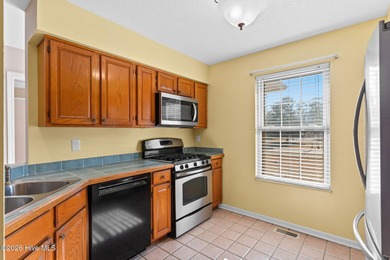 This charming brick home is tucked into an established on Brierwood Golf Club in North Carolina - for sale on GolfHomes.com, golf home, golf lot