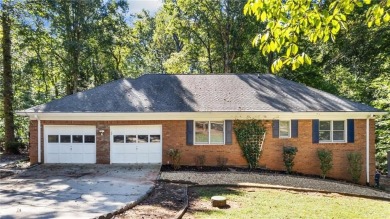 Located in the sought-after Pine Ridge Country Club Estates on Collins Hill Golf Club in Georgia - for sale on GolfHomes.com, golf home, golf lot