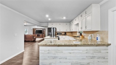 Located in the sought-after Pine Ridge Country Club Estates on Collins Hill Golf Club in Georgia - for sale on GolfHomes.com, golf home, golf lot